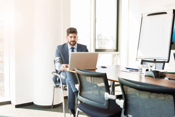istock Professional man working on laptop in a modern office 1423589980
