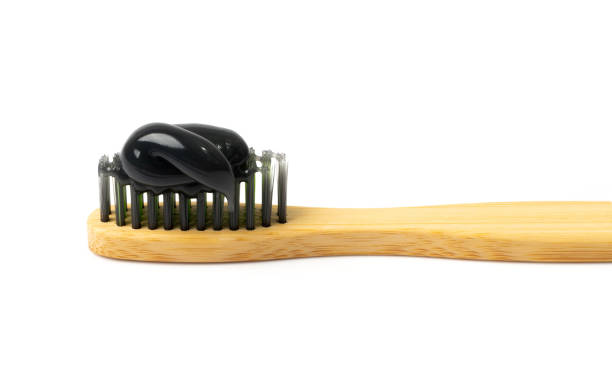 dentifricio al carbone nero - bristle brush part foto e immagini stock