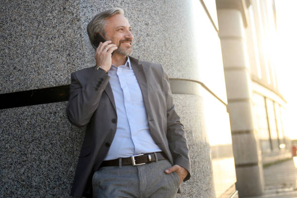 istock Businessman talking on a phone 1423591734
