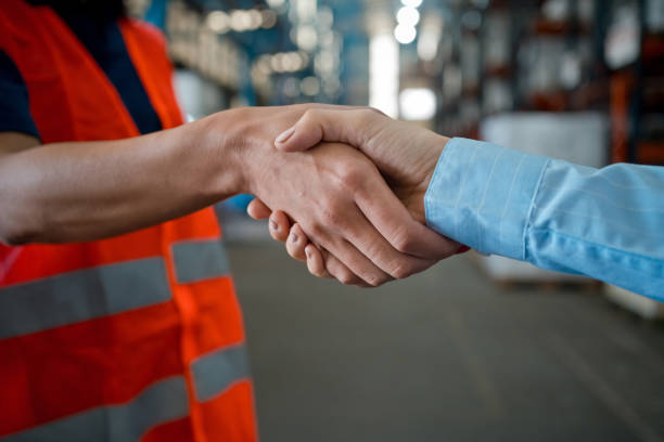 istock Male worker shaking hands with manager in warehouse 1423591860