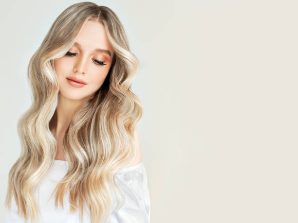 portrait of young woman with elegant long hair dyed in the shades of blonde.hairdressing and professional dyeing. - blond woman imagens e fotografias de stock