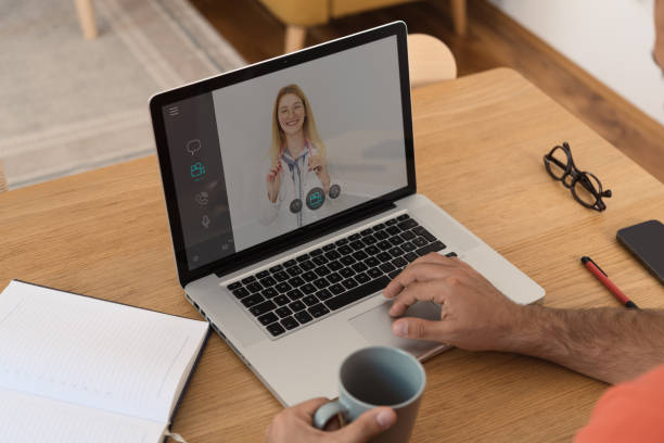istock Female doctor talking with her patient online 1423602745