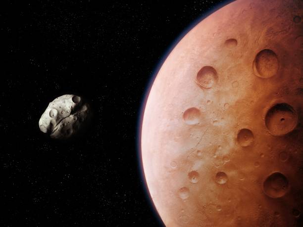 istock Planetary moon, satellite of the red planet covered with craters 1423603959