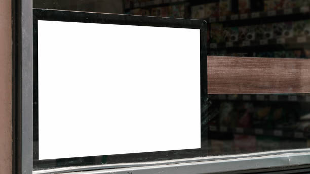 istock Poster with blank mockup space behind supermarket window 1423604482