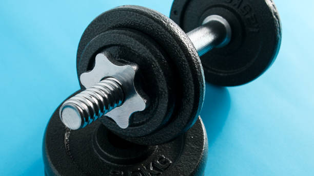 istock Fitness Sport Background eith dumbbells 1423604923