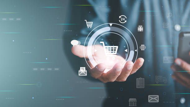 istock Ecommerce concept and online selling website,Retail business with cyberspace technology used to communicate between store owner and customer.A virtual shopping cart in the hands of a man. 1423606994