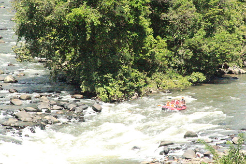 This photo is a photo of a group of people doing white water rafting activities. This photo was taken with the camera