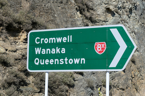 Road sign at a major intersection on the road from Christchurch to Queenstown.  This image was taken on a sunny afternoon in early Spring.