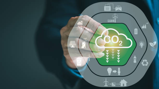 istock Industrial emissions pollute the environment and ecosystems. including climate change Carbon Renewable Energy Agreement reduce greenhouse gas emissions ,Businessman pointing at an icon with a pen 1423608451