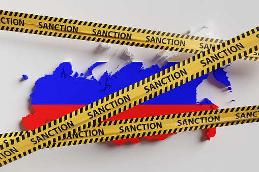 Map of Russia blocked by yellow plastic caution tapes having the word Sanction. Illustration of the concept of international trade sanction on Russia