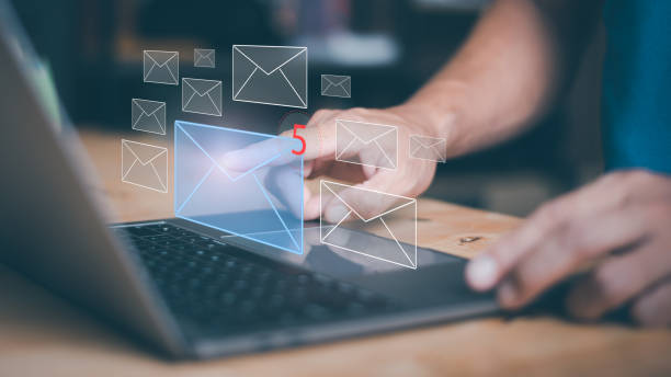 istock Businessman using laptop to open e-mail via virtual screen, Internet messaging concept, social media marketing, communicating with modern technology, online mail. 1423610141