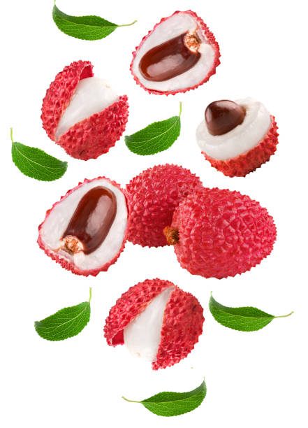 istock flying fresh lychee with slices and green leaves isolated on white background. clipping path 1423611067
