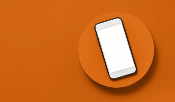 istock Blank screen smartphone with clipping path on orange podium 1423612236