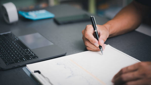 istock business people checking business contract documents Transaction and document management concepts include negotiating legal entities and filling out legal forms or agreements. 1423612250