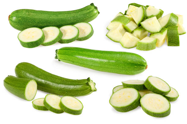 istock fresh green zucchini or marrow with slices isolated on white background.  clipping path 1423612255