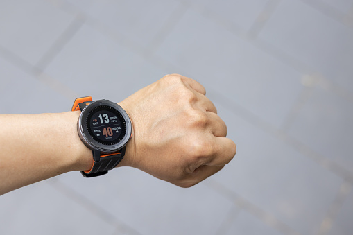 Men hands wearing the smart watch