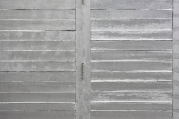 Old wooden door painted silver.