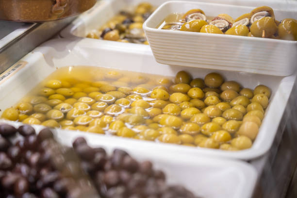 Variety of pickled olives on the market in Barcelona, Spain stock photo