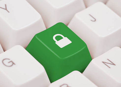Computer key with lock icon, green color