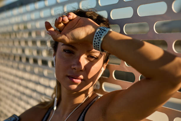 istock A sportswoman taking a break after running on the bridge 1423624868