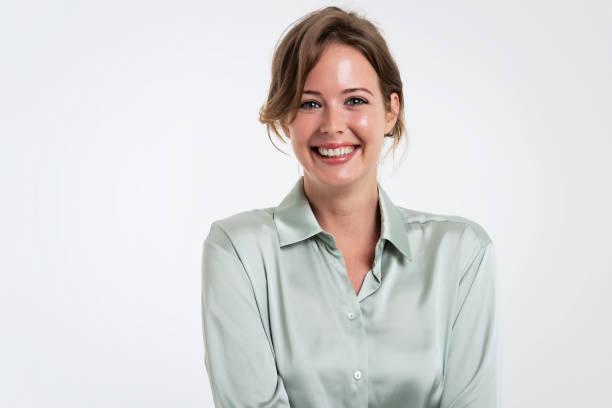 istock Happy woman studio portrait while standing at isolated background 1423627167