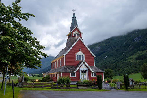 Cemetery with church in Norway on sunset