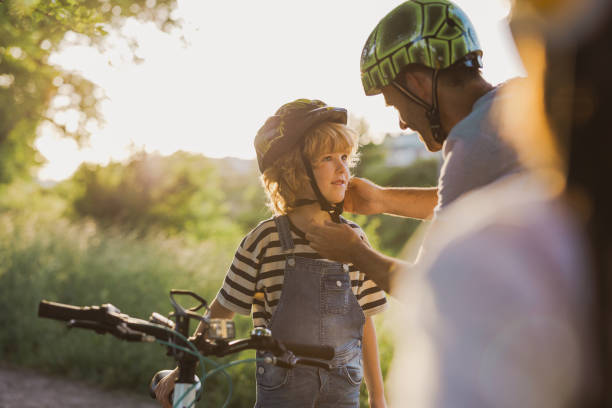 istock Shot of a father adjusting his son's helmet 1423632549