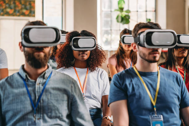 istock Group of people wearing virtual reality VR glasses during a virtual meeting 1423632873