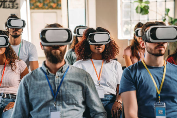istock Group of people wearing virtual reality VR glasses during a virtual meeting 1423632883