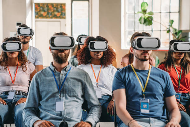 istock Group of people wearing virtual reality VR glasses during a virtual meeting 1423632884