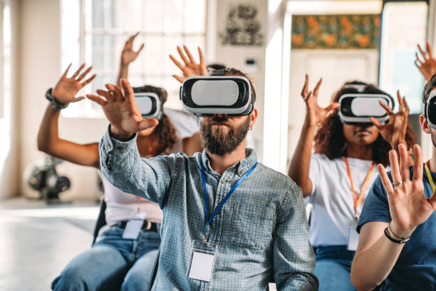 istock People wearing virtual reality VR goggles during a conference 1423632902