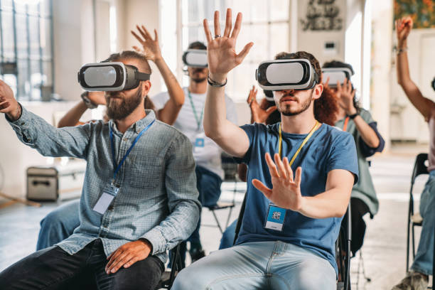 istock People wearing virtual reality VR goggles during a conference 1423632907
