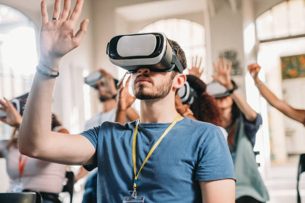 People wearing virtual reality VR goggles during a conference