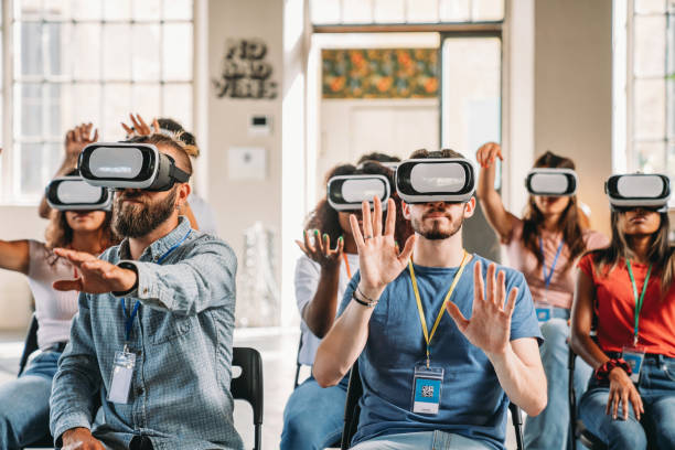 istock People wearing virtual reality VR goggles during a conference 1423632920