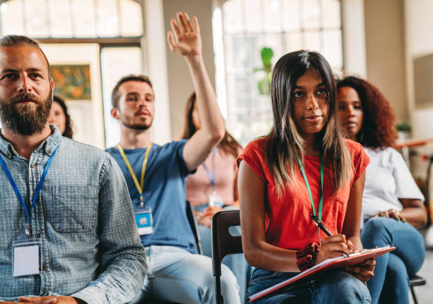 istock Group of people sitting during a meeting 1423632924