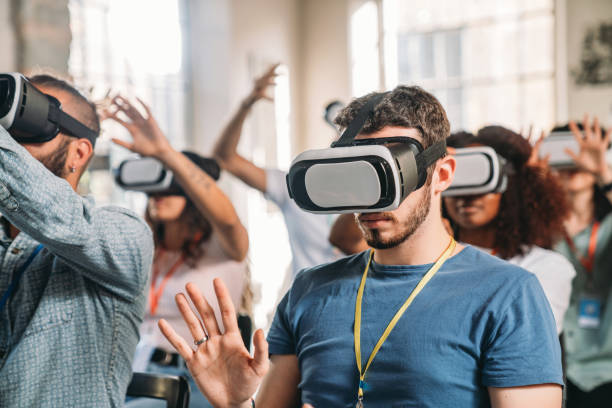 istock People wearing virtual reality VR goggles during a conference 1423632925