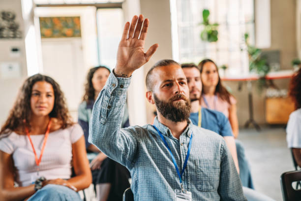 istock Group of people sitting during a meeting 1423632936