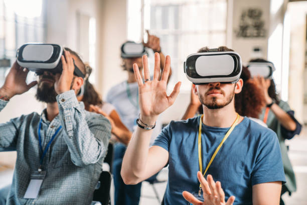 istock People wearing virtual reality VR goggles during a conference 1423633001
