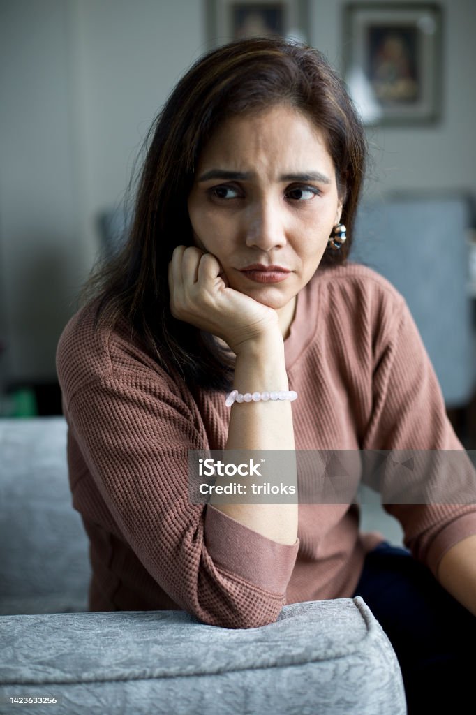 Upset woman suffering from depression Worried young woman suffering from depression Mental Health Stock Photo