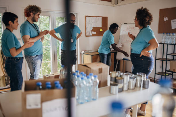 istock Group of volunteers working together 1423633721