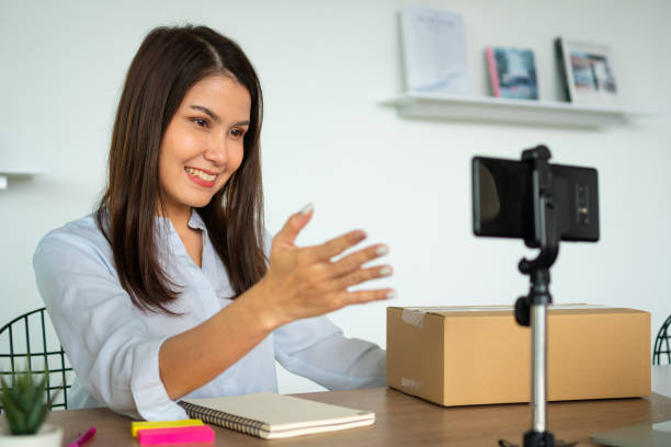istock Successful businesswoman vlogger coach talking to camera for video live and training teaching people for how to succeed online marketing, Small business owner, online market delivery concept 1423635585