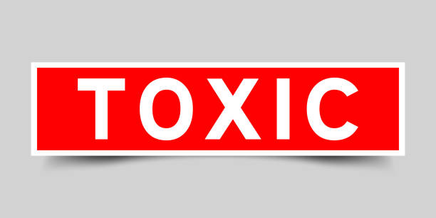 istock Red color square shape sticker label with word toxic on gray background 1423635719