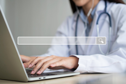 Searching browsing internet bar on Asian woman doctor is online visiting with a patient background, Concept of Searching Browsing Internet Data Information Networking for medical and healthcare