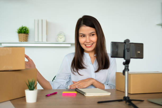 istock Successful businesswoman vlogger coach talking to camera for video live and training teaching people for how to succeed online marketing, Small business owner, online market delivery concept 1423636473
