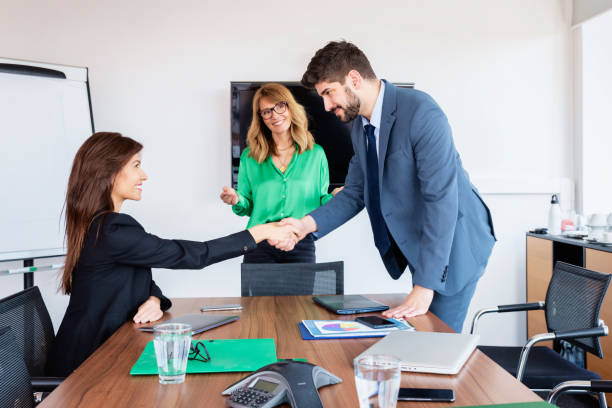istock Business people shaking hands during business meeting 1423637395
