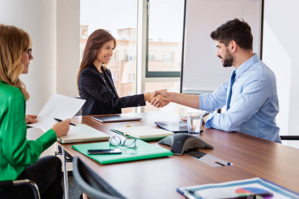 istock Business people shaking hands during business meeting 1423637398