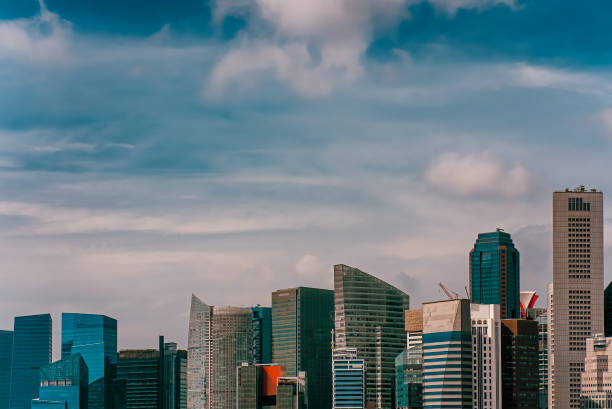 istock Singapore financial district cityscape with blue sky 1423637796