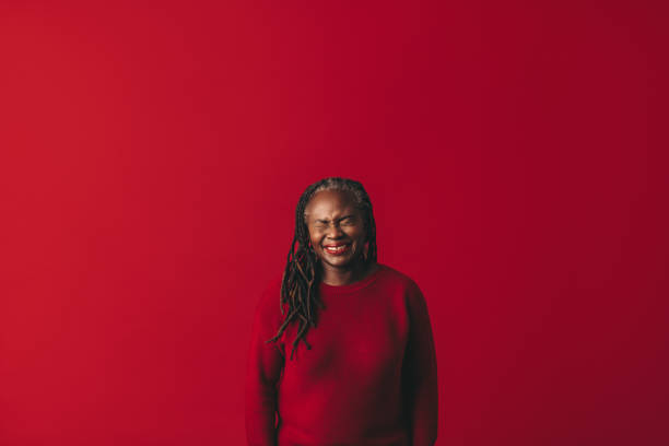 istock Woman with dreadlocks laughing happily in a studio 1423638084