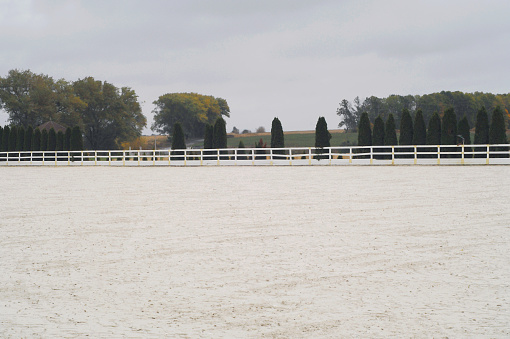 Hippodrome field or arena for equestrian sports and recreational activities with a green area. Close-up