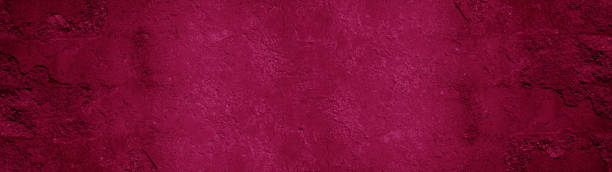 istock Abstract old aged damaged cracked grunge pink magenta colored concrete cement plaster facade wall texture colorful background banner panorama wide pattern 1423638165